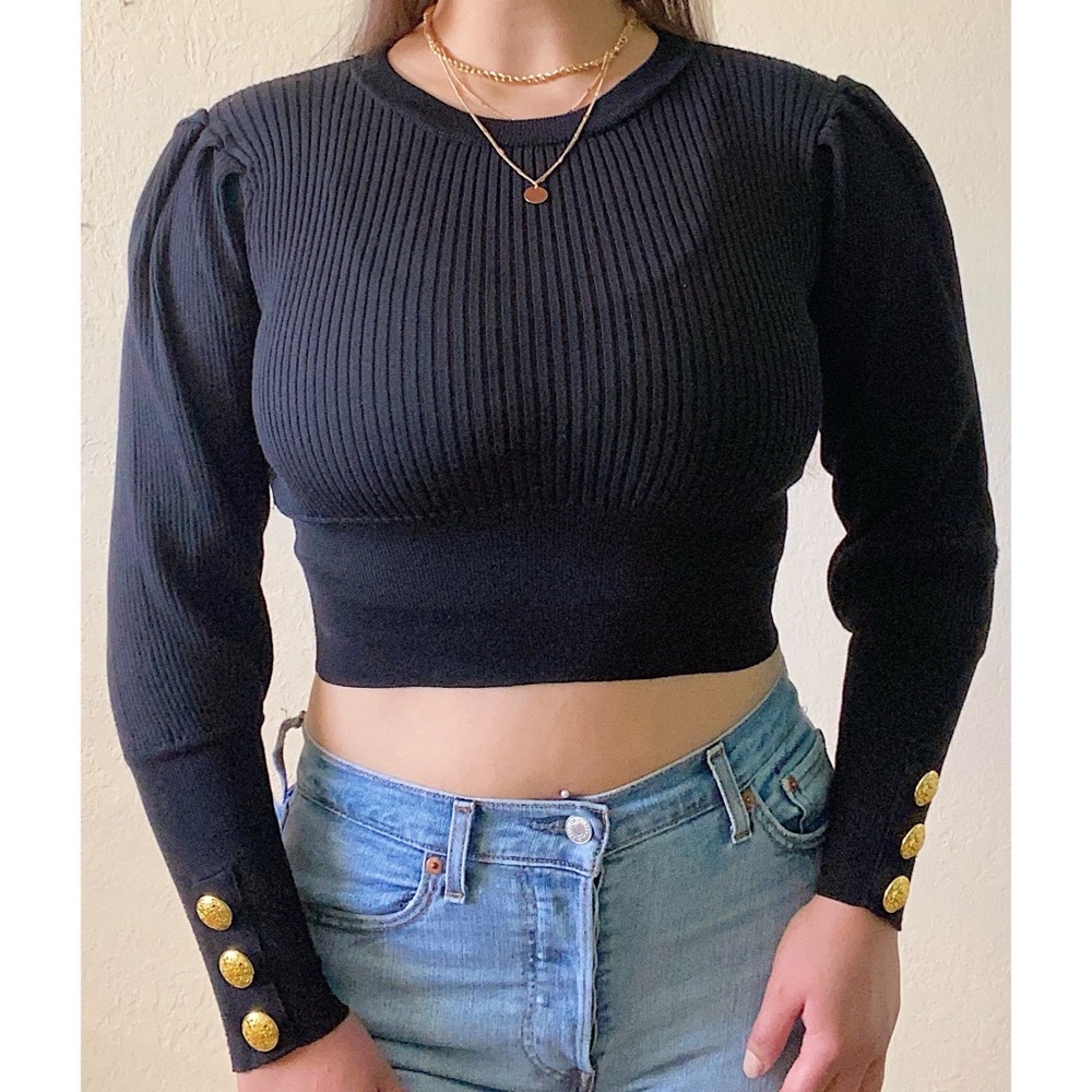 Vintage-style knit crop top with leg of mutton sleeves and golden buttons